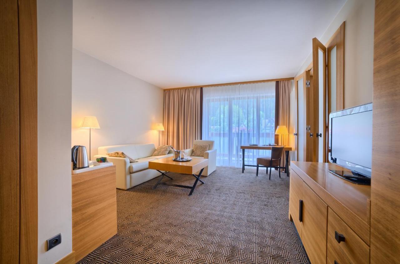 Suite mit 1 Schlafzimmer mit Queensize-Bett und Schlafsofa.