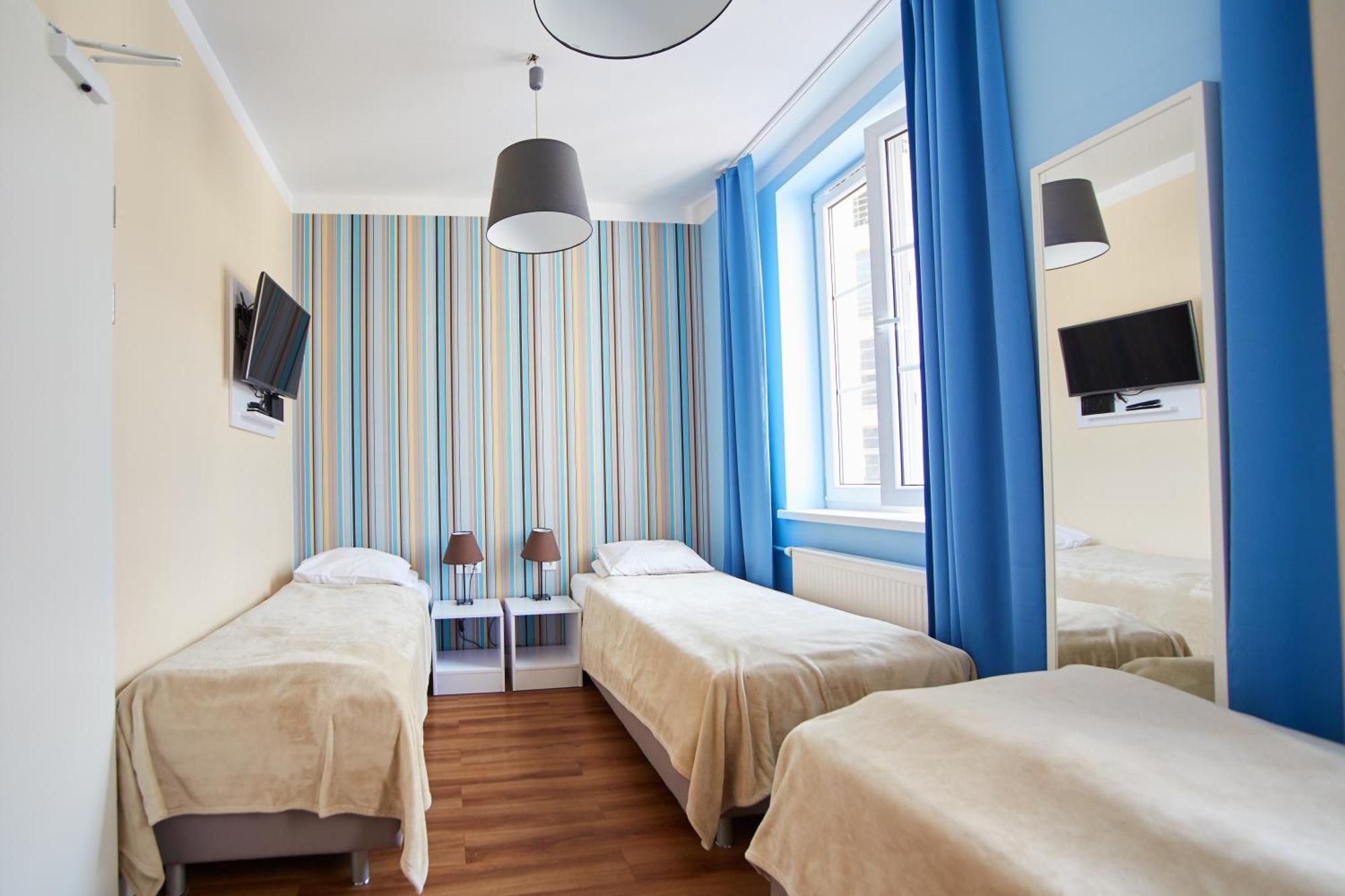 Deluxe Dreibettzimmer mit eigenem Bad