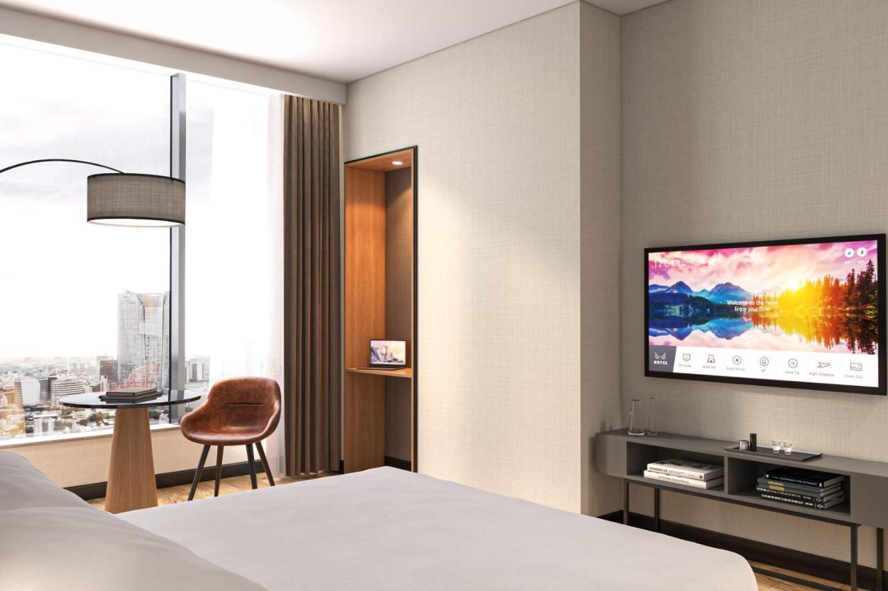 Deluxe Zimmer mit Kingsize-Bett, Schlafsofa und Stadtblick