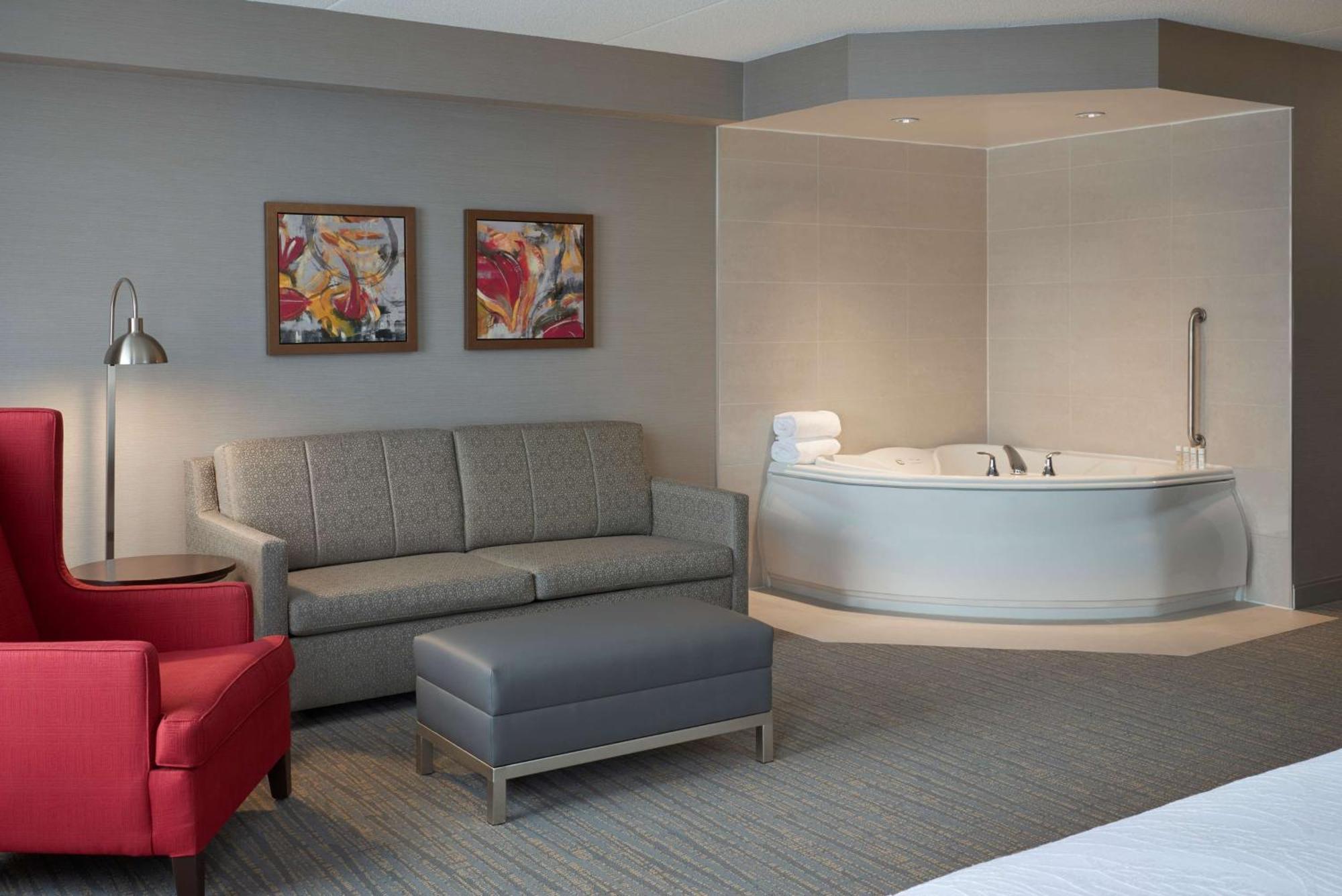 Suite mit 1 Schlafzimmer mit Kingsize-Bett und Whirlpool