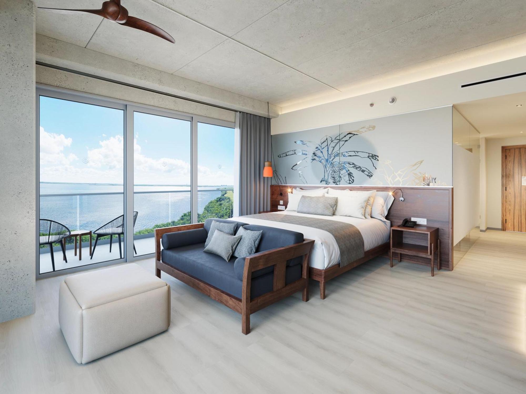 Vantage Club Ecksuite mit Kingsize-Bett und Blick auf die Bucht