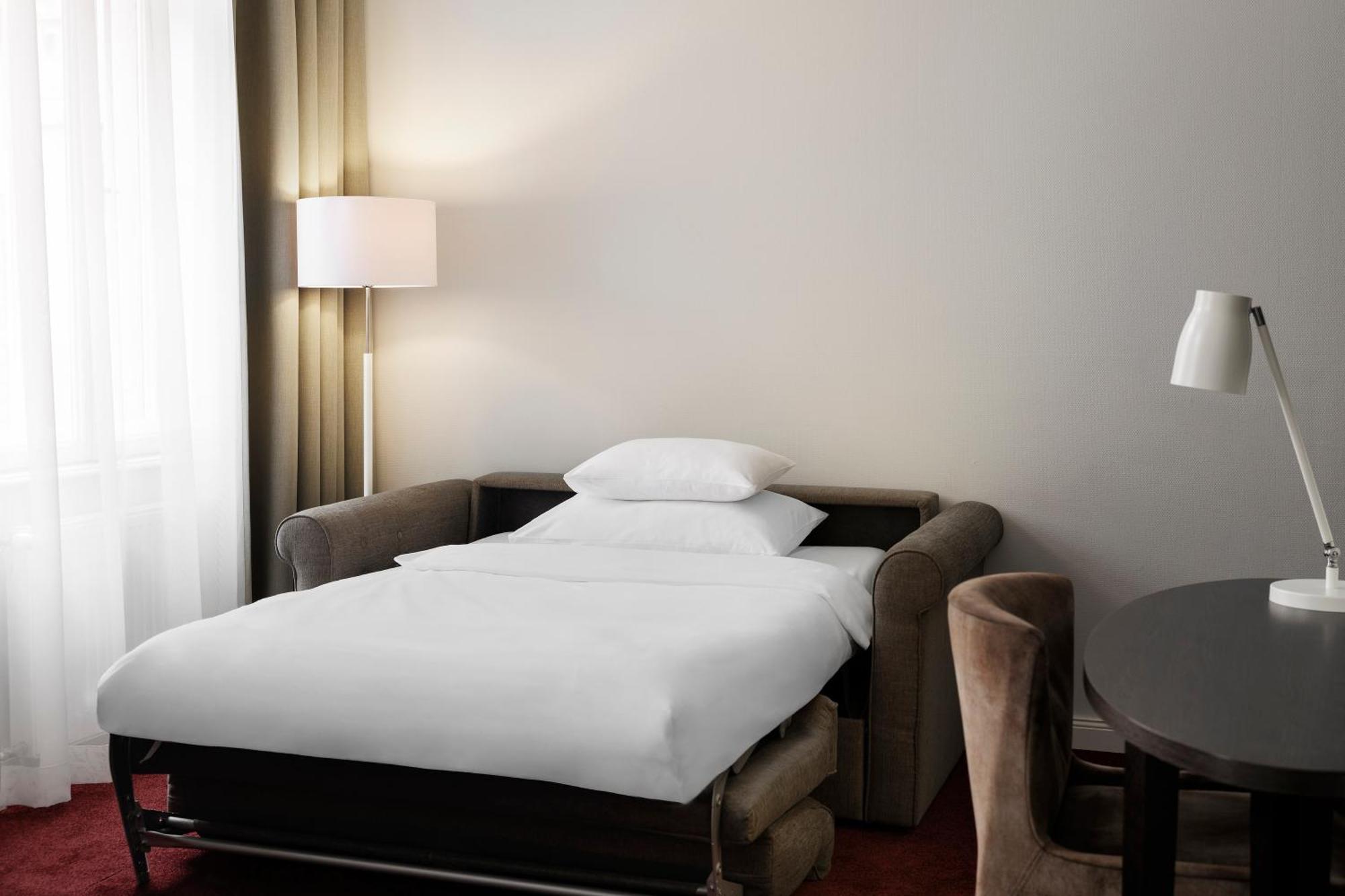 Deluxe-Zimmer mit einem Queensize-Bett und einem Schlafsofa