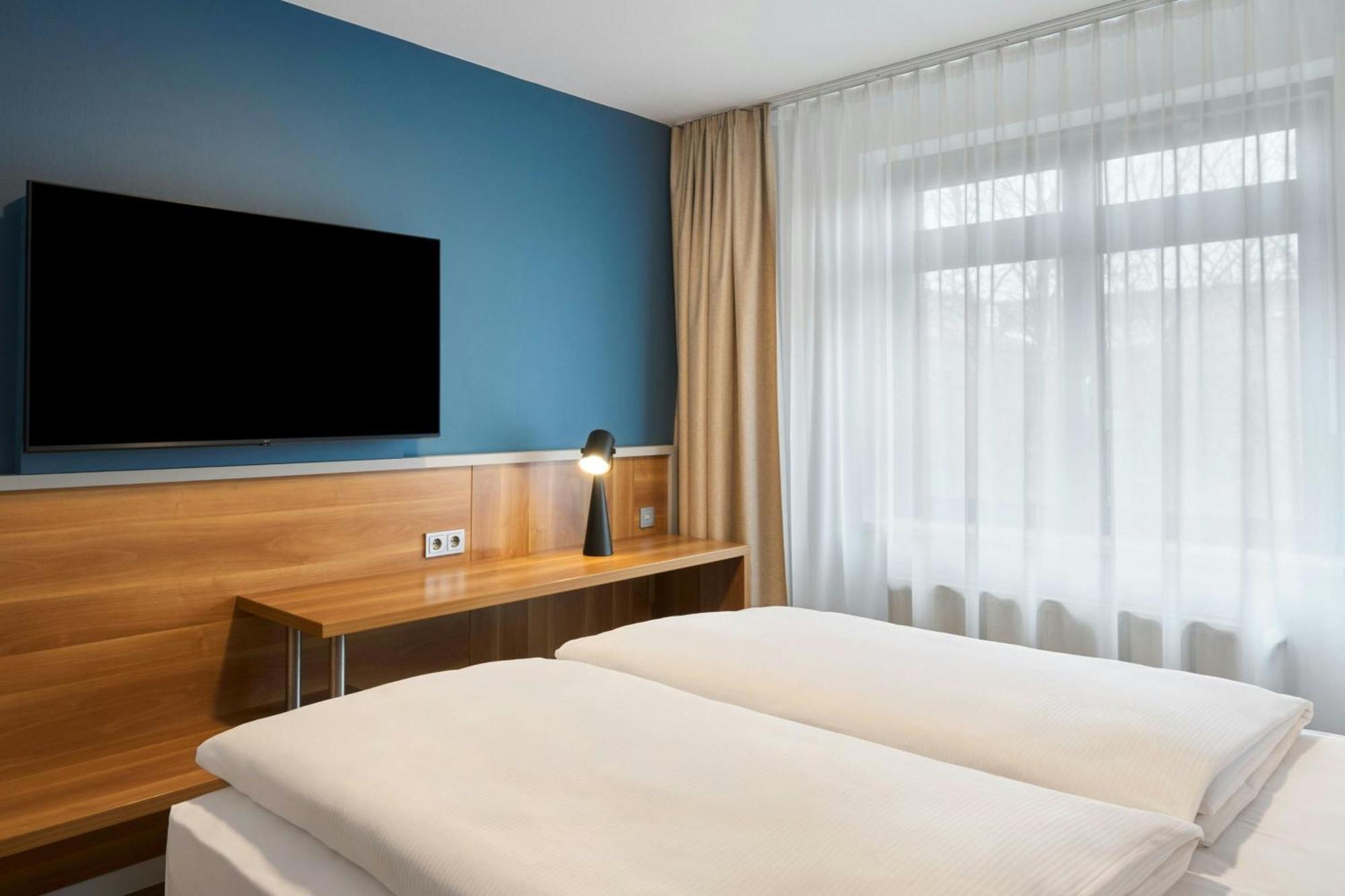 Standard Zimmer mit Queensize-Bett und Gartenblick
