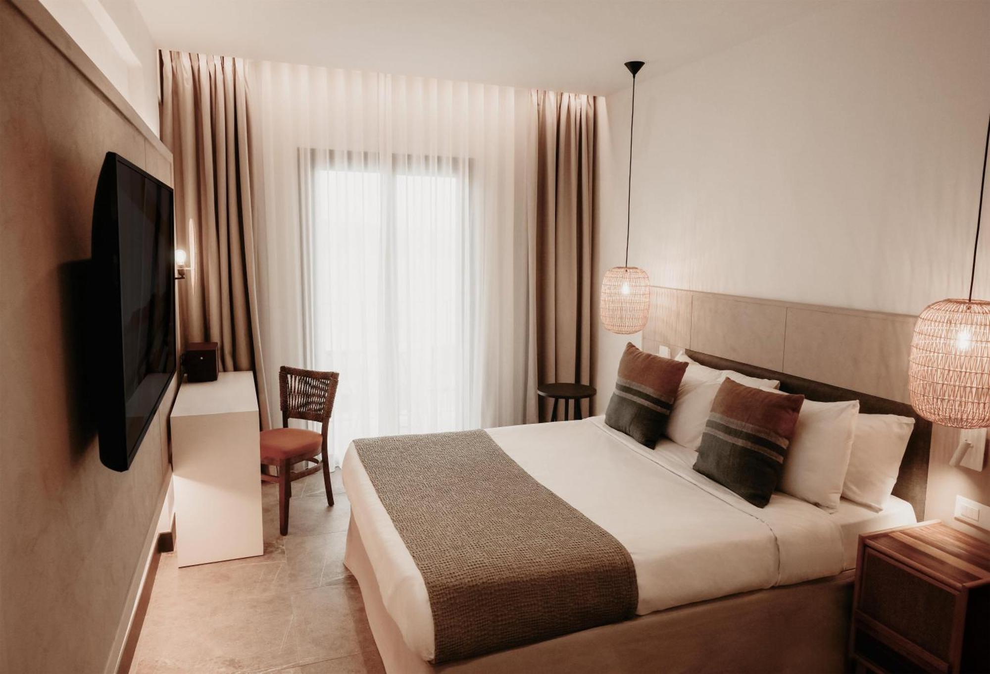 Zimmer mit Queensize-Bett und Meerblick